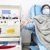  Bệnh nhân nhiễm COVID-19 hiến huyết tương sau khi được điều trị khỏi bệnh, tại Trung tâm hiến máu Vũ Hán, tỉnh Hồ Bắc, Trung Quốc, ngày 17/2/2020. (Ảnh: THX/ TTXVN)
