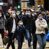 Người dân đeo khẩu trang phòng lây nhiễm virus corona tại Hong Kong, Trung Quốc, ngày 27/1/2020. (Ảnh: AFP/TTXVN)