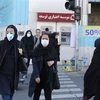 Người dân đeo khẩu trang phòng lây nhiễm COVID-19 tại Tehran, Iran, ngày 2/3/2020. (Ảnh: AFP/TTXVN)