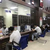Người dân đến làm thủ tục hành chính tại Trung tâm phục vụ hành chính công tỉnh Yên Bái, trong Quý I năm 2020. (Ảnh: Việt Dũng/TTXVN)