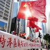 Người dân bày tỏ sự ủng hộ đối với việc phê chuẩn Luật bảo vệ an ninh quốc gia tại Đặc khu hành chính Hong Kong (Trung Quốc) tại Hong Kong ngày 30/6/2020. (Ảnh: THX/TTXVN)