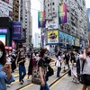 Người dân đeo khẩu trang phòng dịch COVID-19 tại Hong Kong, Trung Quốc ngày 13/5/2020. (Ảnh: AFP/TTXVN)