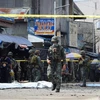 Cảnh sát và binh sỹ phong tỏa hiện trường một vụ nổ tại Jolo, tỉnh Sulu, Philippines, ngày 27/1/2019. (Ảnh: AFP/TTXVN)
