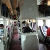 Hành khách trên xe rời Đà Nẵng được bố trí giãn cách để phòng chống dịch COVID-19. (Ảnh: Trần Lê Lâm/TTXVN)