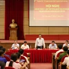 Lãnh đạo Thành ủy, UBND thành phố Hà Nội đối thoại với người dân bãi rác Nam Sơn (Sóc Sơn) về chính sách đền bù giải phóng mặt bằng (Ảnh Mạnh Khánh/Vietnam+)