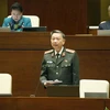 Bộ trưởng Bộ Công an Tô Lâm giải trình ý kiến của đại biểu Quốc hội nêu. (Ảnh: Doãn Tấn/TTXVN)