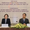 Thứ trưởng Bộ Ngoại giao Tô Anh Dũng và Trưởng Đại diện Phái đoàn IOM Việt Nam Park Mi Hyung chủ trì hội nghị. (Ảnh: Lâm Khánh/TTXVN)