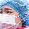 Một nữ y tá làm viêc tại bệnh viện ở Vũ Hán, tỉnh Hồ Bắc, Trung Quốc, ngày 29/3/2020. (Ảnh: THX/TTXVN)