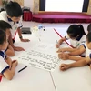 Tại Hội đồng Trẻ em tỉnh Quảng Trị, các em tham gia thảo luận và giải quyết các tình huống với nội dung xung quanh 4 nhóm quyền của trẻ em. (Ảnh: Hồ Cầu/TTXVN)