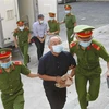 Bị cáo Nguyễn Thành Tài, nguyên Phó Chủ tịch UBND Thành phố Hồ Chí Minh được áp giải đến phiên tòa ngày 15/3. (Ảnh: Thanh Vũ/TTXVN)