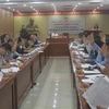Đại biểu dự hội nghị tham gia biểu quyết danh sách những người đủ tiêu chuẩn ứng cử Đại biểu Quốc hội khóa XV đơn vị tỉnh Cao Bằng. (Ảnh: Chu Hiệu/TTXVN)