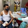 Tiêm vaccine ngừa COVID-19 cho người dân tại bang Uttar Pradesh, Ấn Độ, ngày 10/4/2021. (Ảnh: THX/TTXVN)