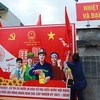 Pano tuyên truyền về ngày bầu cử ở phường Tân An, thị xã Quảng Yên (Quảng Ninh). (Ảnh: TTXVN phát)