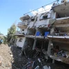 Một tòa nhà bị phá hủy sau vụ oanh kích của Israel xuống thành phố Khan Younis, Dải Gaza ngày 12/5/2021. (Ảnh: THX/TTXVN)