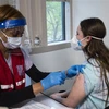 Người dân được tiêm vaccine ngừa COVID-19 tại Fairfax, bang Virginia, Mỹ ngày 13/5/2021. (Ảnh: AFP/TTXVN)