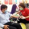 Người dân Thành phố Hồ Chí Minh tham gia hiến máu tình nguyện trong sáng 23/1. (Ảnh: Đinh Hằng/TTXVN)