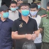 Đối tượng Bùi Văn Thuận bị lực lượng chức năng bắt giữ. (Ảnh: TTXVN)