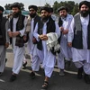 Các quan chức Taliban trong cuộc họp báo tại sân bay Kabul, sau khi Mỹ hoàn tất việc rút quân và sơ tán công dân khỏi Afghanistan, ngày 31/8. (Ảnh: AFP/TTXVN)