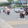 Các loại phương tiện di chuyển đông đúc trên đường Trường Chinh, khu vực trước Khu Công nghiệp Tân Bình. (Ảnh: Xuân Tình/TTXVN)