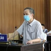 Nguyên Phó Chủ tịch HĐND thị xã Nghi Sơn Hồ Đình Tùng lãnh 30 tháng tù giam. (Ảnh: Nguyễn Nam/TTXVN)