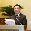 Bộ trưởng Bộ Tài chính Hồ Đức Phớc trình bày Tờ trình về dự án Luật Kinh doanh bảo hiểm (sửa đổi). (Ảnh: Doãn Tấn/ TTXVN)