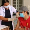 Tiêm vaccine phòng COVID-19 cho người dân xã miền núi Đăng Hà, huyện Bù Đăng, Bình Phước. (Ảnh: Sỹ Tuyên/TTXVN)
