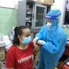 Triển khai tiêm vaccine cho người dân trên địa bàn thị xã Tân Uyên, tỉnh Bình Dương. (Ảnh: Chí Tưởng/TTXVN)