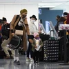 Hành khách tại sân bay quốc tế Los Angeles, bang California, Mỹ. (Ảnh: AFP/TTXVN)