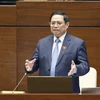 Bộ trưởng Bộ Kế hoạch và Đầu tư Nguyễn Chí Dũng ttrả lời chất vấn. (Ảnh: TTXVN)