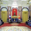 Chủ tịch nước Nguyễn Xuân Phúc tiếp Chủ tịch Quốc hội Lào Xaysomphone Phomvihane.