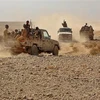 Binh sỹ quân đội chính phủ Yemen giao tranh với lực lượng Houthi tại tỉnh Marib, Yemen, ngày 22/11/2020. (Ảnh: AFP/TTXVN)