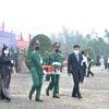 An táng các hài cốt liệt sỹ tại Bình Phước. (Ảnh: TTXVN phát)