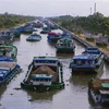 Phương tiện vận tải thủy trên kênh xáng Xà No, đoạn qua thành phố Vị Thanh, tỉnh Hậu Giang. (Ảnh: Duy Khương/TTXVN)
