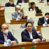 Chủ tịch nước Nguyễn Xuân Phúc, Thủ tướng Chính phủ Phạm Minh Chính và các đại biểu Quốc hội dự phiên họp sáng 7/1. 