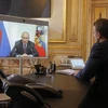 Tổng thống Pháp Emmanuel Macron và Tổng thống Nga Vladimir Putin tại một cuộc họp trực tuyến. (Ảnh: AFP/TTXVN)