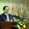 Thủ tướng Phạm Minh Chính chúc Tết và giao nhiệm vụ cho ngành ngân hàng. (Ảnh: Dương Giang/TTXVN)