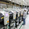 Hoạt động sản xuất tại Công ty Fuhong Precision Component tại Khu công nghiệp Đình Trám (vốn đầu tư của Đài Loan) tại Bắc Giang. (Ảnh: Danh Lam/TTXVN)