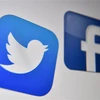 Biểu tượng của Facebook và Twitter trên màn hình máy tính. (Ảnh: AFP/TTXVN)