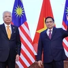 Thủ tướng Phạm Minh Chính và Thủ tướng Malaysia Dato’ Sri Ismail Sabri bin Yaakob chụp ảnh chung. (Ảnh: Dương Giang/TTXVN)