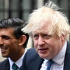 Thủ tướng Anh Boris Johnson (phải). (Ảnh: AFP/TTXVN)