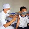 Công tác tiêm chủng vaccine COVID-19 cho trẻ em tại tỉnh Bạc Liêu. (Ảnh: TTXVN)