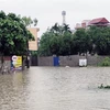 Nhiều khu dân cư tại thành phố Thái Nguyên hiện vẫn ngập sâu trong nước. (Ảnh: Quân Trang/TTXVN)