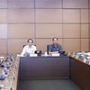 Đoàn đại biểu Quốc hội các tỉnh Quảng Ngãi, Hà Nam, Tuyên Quang và Bình Định thảo luận ở tổ. (Ảnh: Doãn Tấn/TTXVN)