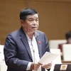 Bộ trưởng Bộ Kế hoạch và Đầu tư Nguyễn Chí Dũng phát biểu giải trình, làm rõ một số vấn đề đại biểu Quốc hội nêu. (Ảnh: Doãn Tấn/TTXVN)