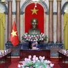 Chủ tịch nước Nguyễn Xuân Phúc tiếp bà Khemmani Pholsena, Bộ trưởng, Chủ nhiệm Văn phòng Chủ tịch nước Lào. (Ảnh: Thống Nhất/TTXVN)