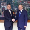 Bộ trưởng Bộ Công an Tô Lâm với Bộ trưởng Tư pháp Nhật Bản Furukawa Yoshihisa. (Ảnh: Phạm Kiên/TTXVN)