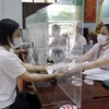Ngân hàng Chính sách Xã hội tỉnh Bắc Giang giải ngân vốn vay ưu đãi theo Nghị quyết 11 của Chính phủ. (Ảnh: Đồng Thúy/TTXVN)