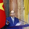 Chủ tịch nước Nguyễn Xuân Phúc phát biểu tại buổi gặp mặt. (Ảnh: Thống Nhất/ TTXVN)