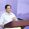 Thủ tướng Phạm Minh Chính chủ trì Hội nghị Phát triển thị trường bất động sản. (Ảnh: Dương Giang/TTXVN)