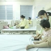 Các bệnh nhi điều trị cúm A tại Khoa Nhi (Bệnh viện Bệnh nhiệt đới Trung ương). (Ảnh: Minh Quyết/TTXVN)